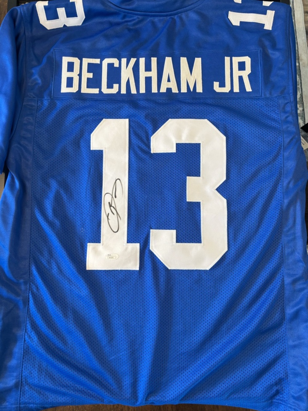 Signed Blue Football Jersey with White Numbers